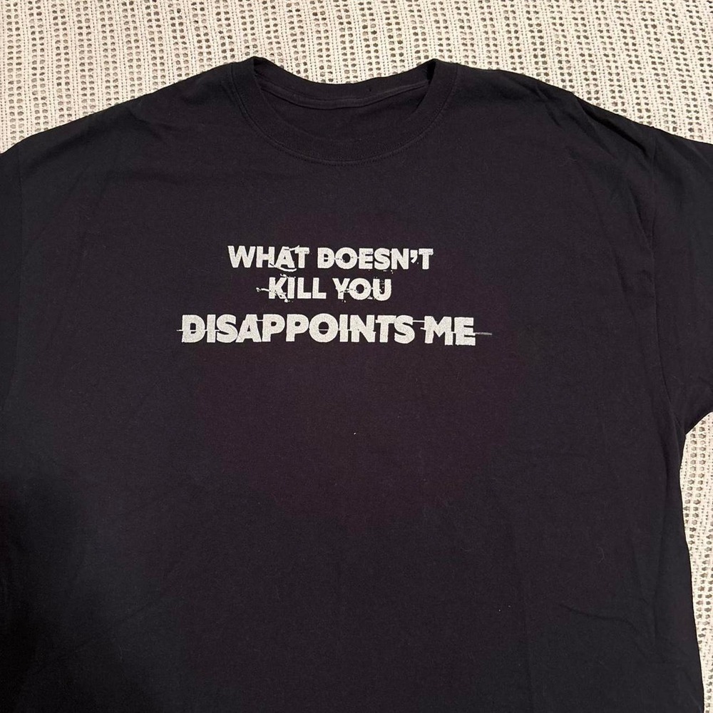 Vintage Y2K funny humor graphic slogan t shirt 'what doesn't kill you' tee